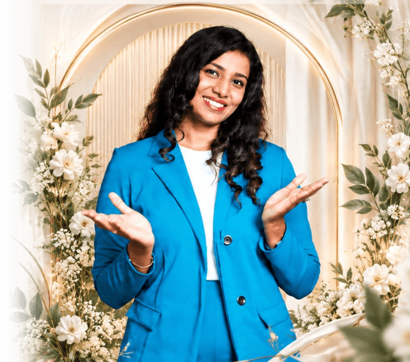 MRS. NANDHINII PARTHIBAN inside ceremonial floral gold arch